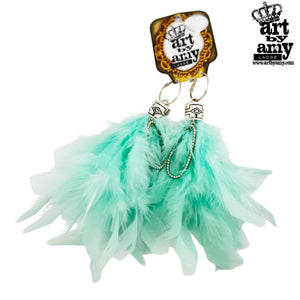 Turquoise feathered keychain with 'art by amy' branding on a white background